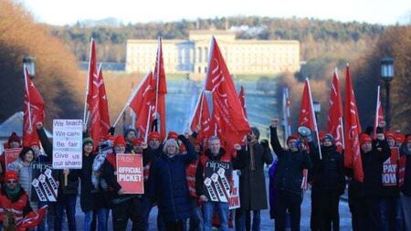 Icy roads left ungritted and schools shut as thousands strike in Northern Ireland