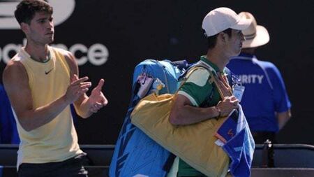 Dominant Carlos Alcaraz through as Shang Juncheng retires injured