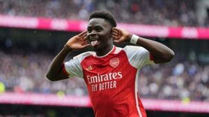Arsenal withstand Tottenham’s second-half fightback to boost title hopes