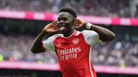 Arsenal withstand Tottenham’s second-half fightback to boost title hopes
