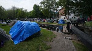 Asylum seeker tents not removed because of Europa League final, insists minister