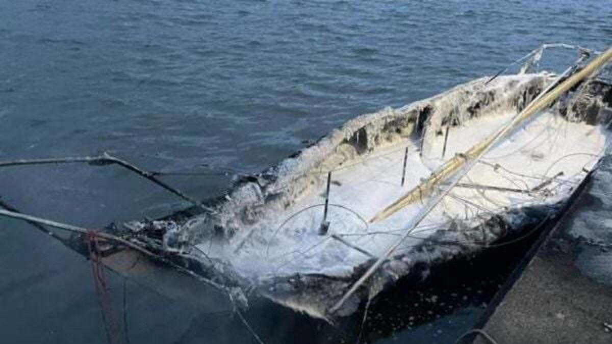 Three arrested after boat burned out amid row over Tricolour flag