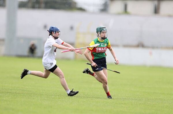 Caoimhe Coady from Carlow is chased by Kildare's Caoimhe Shanahan Photo: Pat Ahern