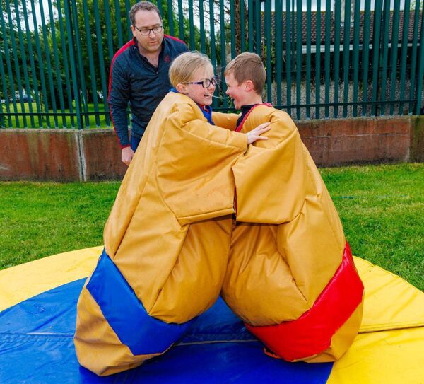 Brother and sister Roisín and Darragh O’Neill have a friendly wrestle in the sumo suits as Tiernan McNamara looks on. Photo: michaelorourkephotography.ie Brother and sister Roisín and Darragh O’Neill have a friendly wrestle in the sumo suits as Tiernan McNamara looks on. Photo: michaelorourkephotography.ie