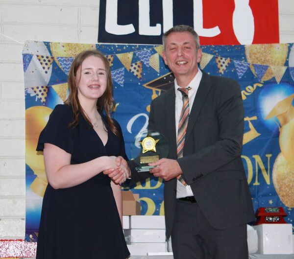 Aideen Stein receives a Student of the Year Award from Mr Hutton Aideen Stein receives a Student of the Year Award from Mr Hutton