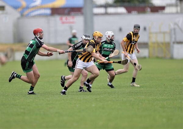 Scott Treacy from Naomh Eoin breaks through the Bagenalstown Gaels defence on Saturday Photo: Pat Ahern 