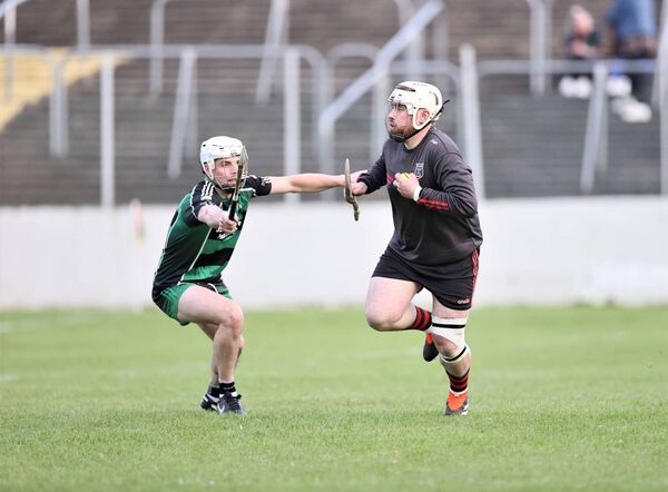 MlR goal keeper Dean Grennan has a look up with Jason Wall from Bagenalstown closing down the angle Photo: Pat Ahern