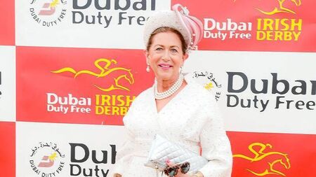 Trusty white suit ensures Liz is crowned best dressed at Irish Derby