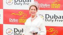 Trusty white suit ensures Liz is crowned best dressed at Irish Derby