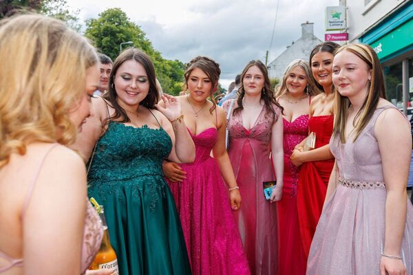 Debutantes gather outside O'Shea's on Main Street in Borris before heading for the debs Photos: michaelorourkephotography.ie