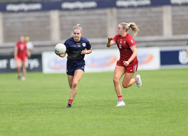 Sara Doyle runs towards the Louth goal with Aoife Russell about to tackle Photo: Pat Ahern