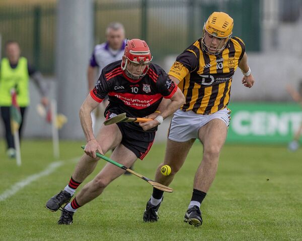 Mount Leinster Rangers Dean Tobin and Naomh Eoin's Scott Tracey. Photo: Thomas Nolan Photography. 