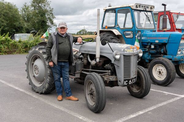 Pat Abbey beside his vintage tractor 