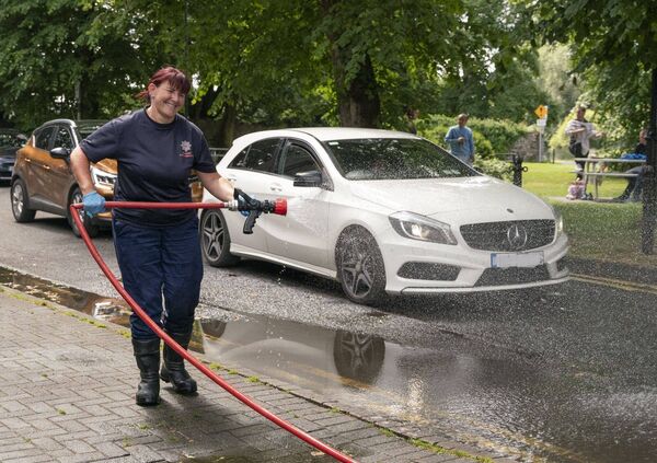 Fireighter Clare Gorman is ready to deploy the hose Fireighter Clare Gorman is ready to deploy the hose