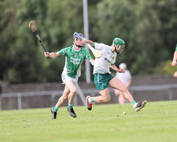Dylan Townsend (Burren Rangers) comes under pressure from St Mullins Conor Ryan Photo: Pat Ahern