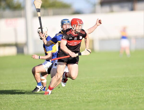 Ciaráin Kavanagh races for the Ballinkillen goal in the first half with Kevin Kavanagh close behind.
