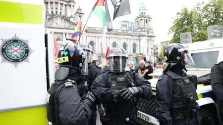 Violent clashes and businesses attacked amid anti-immigration protest in Belfast