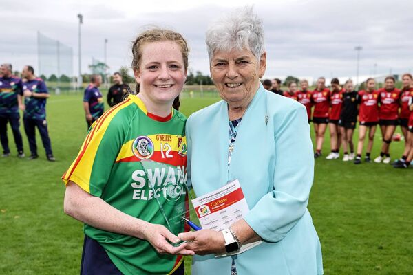 Carlow's Rachel Kennedy is presented with the Player of the Match award by former President of The Camogie Association Phyllis Breslin Photo: ©INPHO/Laszlo Geczo Carlow's Rachel Kennedy is presented with the Player of the Match award by former President of The Camogie Association Phyllis Breslin Photo: ©INPHO/Laszlo Geczo