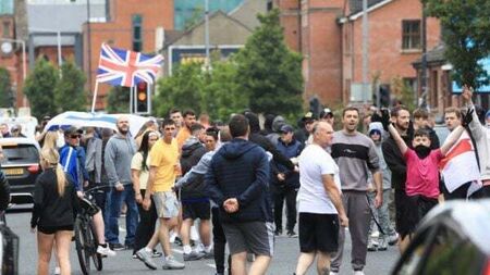 Police attacked in Belfast and suspected hate crime victim in serious condition