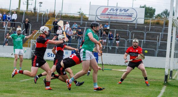 Naomh Moling’s John Doyle sends his shot into the side netting. Photo: michaelorourkephotography.ie