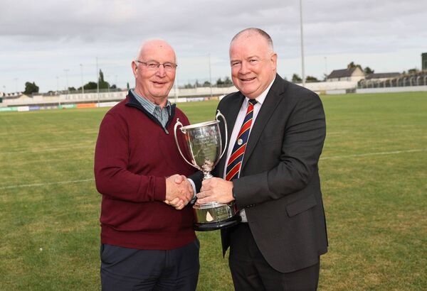 Tom Rea, son of the legendary Jimma Rea, presents the Jimma Rea Memorial Cup to Carlow GAA Chairman Jim Bolger, which will be presented to the U20 football 'A' winners. Photo: Pat Ahern