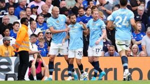 Man City start pursuit for fifth straight league title with victory at Chelsea