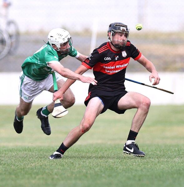 Ciaran Harris (St Mullins) puts Ted Joyce (MLR) under pressure Photo: Pat Ahern
