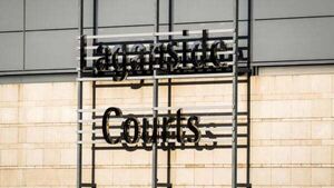 Woman arrested in probe into Belfast disorder Woman arrested in probe into Belfast disorder