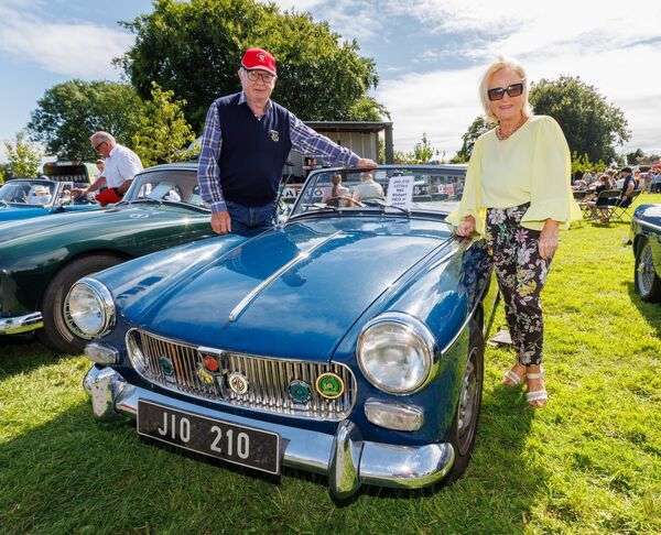 Pat and Dympna Bramley pictured with their vintage 1275 MG Midget car