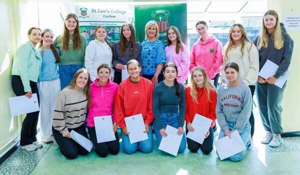 Niamh Broderick (principal) with some of the students who picked up their leaving cert results at St. Leo’s College. Photo: michaelorourkephotography.ie