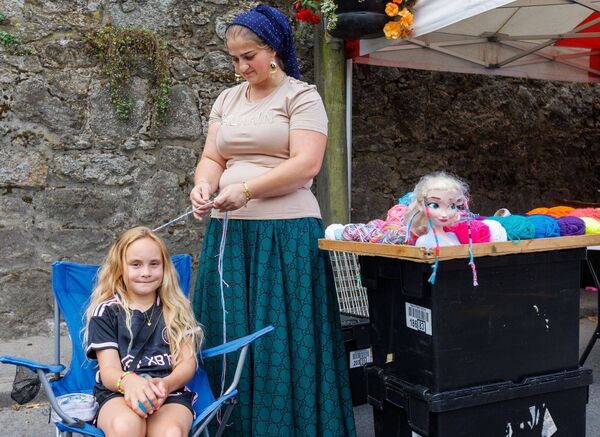 Vivianna Slaboz has her hair plaited at the Borris Fair