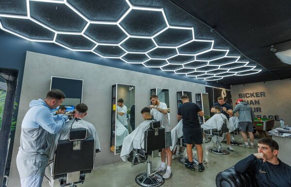 All the barbers in action at The Lad Pad Barbershop