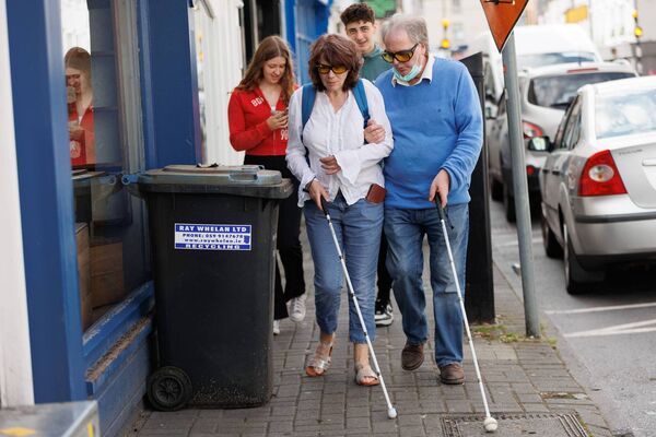 Noreen Carter and her partner Will McGill highlighting the 'Clear Our Footpath' campaign on Tullow Street 