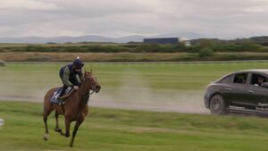 Manes vs motors: Max Hart races alongside a galloping racehorse Manes vs motors: Max Hart races alongside a galloping racehorse