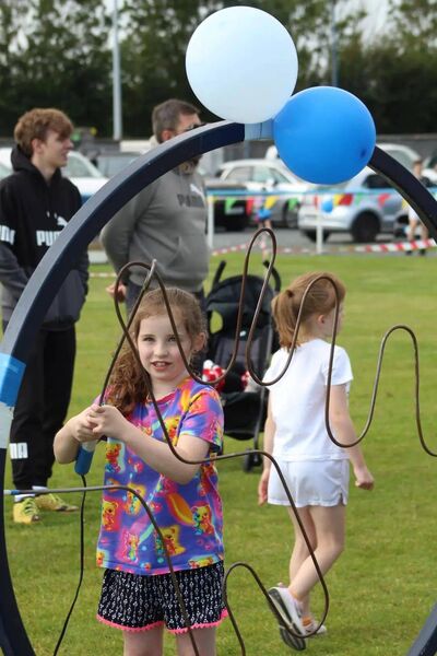 Eva Duggan concentrating on her game of "buzz off" set up by Donal Brennan and his daughters 