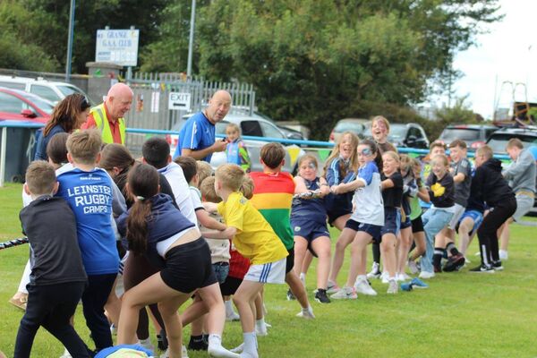 The children giving it their all during the tug of war battle 