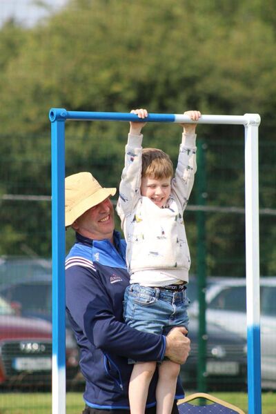 Padraig Murphy helping his son Hugh take part in the 'hanging tough' challenge, made and set up by Cormac Bailey