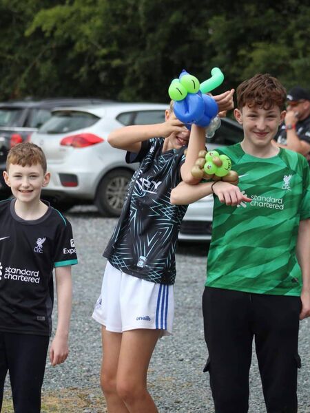 Blake Somers, Killian Nolan and AJ Somers enjoying their balloon animals made by Aaron the balloon man 
