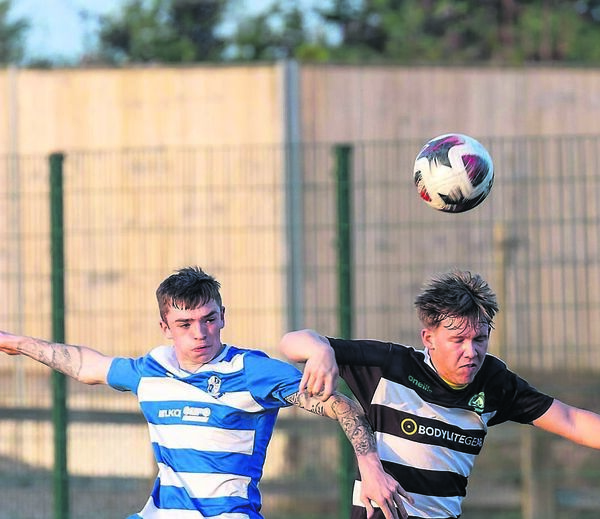 St. Fiacc’s hat-trick hero Scott Roycroft and Burrin Celtic’s Daniel Whelan 	
