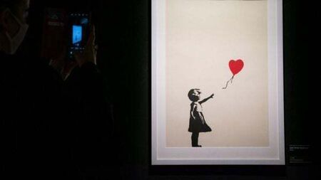 Two charged with burglary after Banksy painting stolen from London gallery