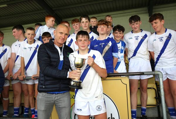 John Farrell from CENTAL main sponsors of Coisde presents the Kelly Cup to Fiach Donnelly, the Carlow Town captain.