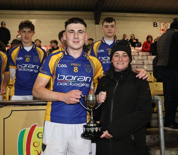 Ballinkillen captain AJ Dooley recieves the trophy from Fiona Corcoran, Secretary of Carlow Coisde Photo:Pat Ahern
