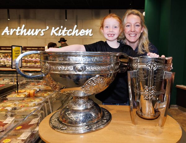 Audrey Kealy and her daughter Charlotte are pictured with the Sam Maguire and Liam McCarthy cup Audrey Kealy and her daughter Charlotte are pictured with the Sam Maguire and Liam McCarthy cup