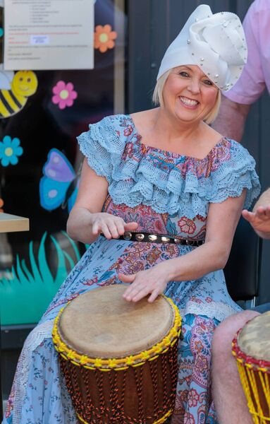 Caroline Davis tries her hand at the African drums in the Cairdeas Centre, Tullow