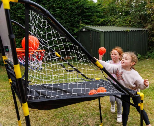 Isabel Dunne and Sara Healy shooting hoops at the Ardattin NS and Community Development Group's BBQ at the Ardattin Community Hall. Photo: michaelorourkephotography.ie