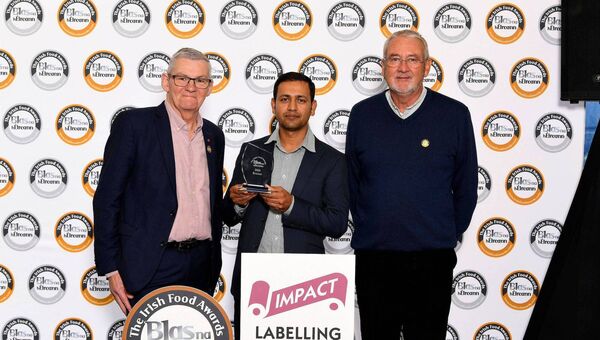 Jamiul Alam of New Moon Restaurant inTullowaccepts his award from Artie Clifford and Richard Fox of sponsor IMPACT Labelling Systems Jamiul Alam of New Moon Restaurant inTullowaccepts his award from Artie Clifford and Richard Fox of sponsor IMPACT Labelling Systems