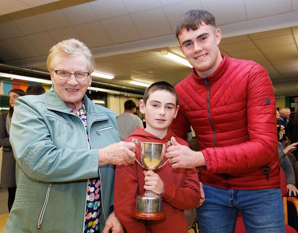 Oisín Doyle who received the Merit Boy of the Year Award at Tullow Community School's Leaving Certificate Awards with his brother Fionn and grandmother Vera Lomax
