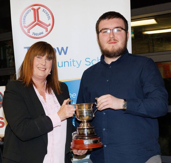 Aaron Kiernan receives the social awareness award from Colette Leech