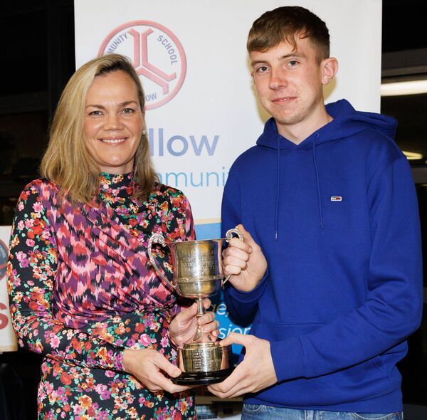 Conor Cleary receives the Best Leaving Cert Boy Award from Claire Hayes