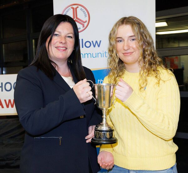 Lucy O'Brien receives the Best Leaving Cert Girl award from Triona Carey